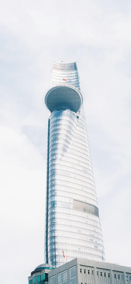 a tall building that has many windows and a clock on it