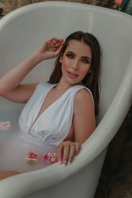 a woman relaxing in the tub with water