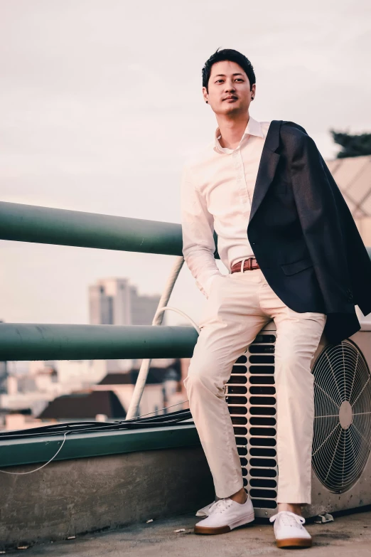 a man standing on a roof looking at soing