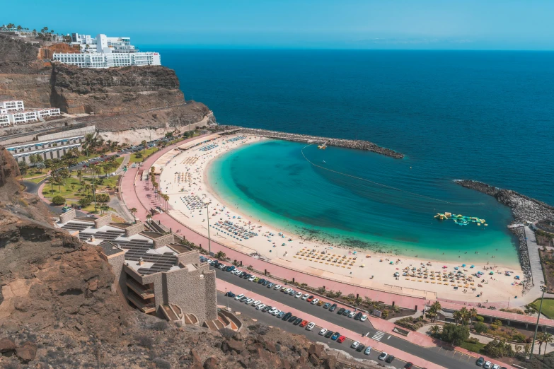 a beach with people on it is seen from an aerial view