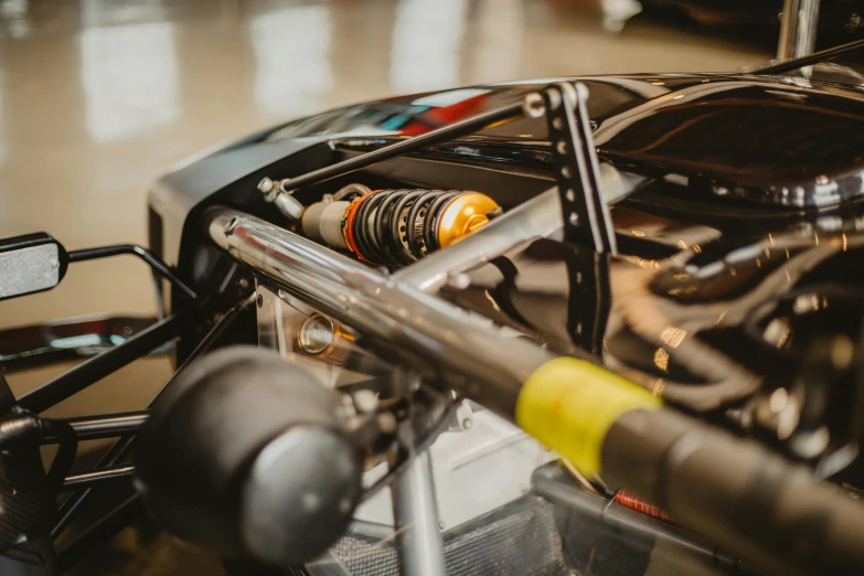 the inside of a racing car with the engine visible