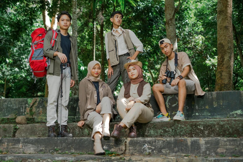 several men are posing for the camera with their backpacks