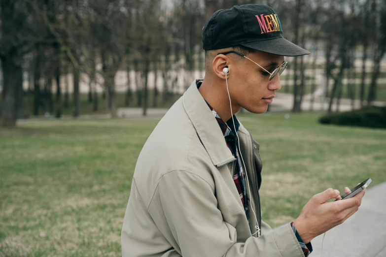 a man with ear buds and headphones on