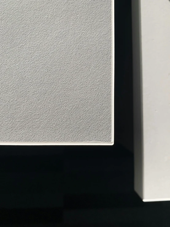 a white square object with very little speckles