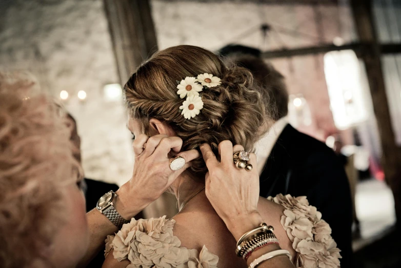 two women that are touching their faces