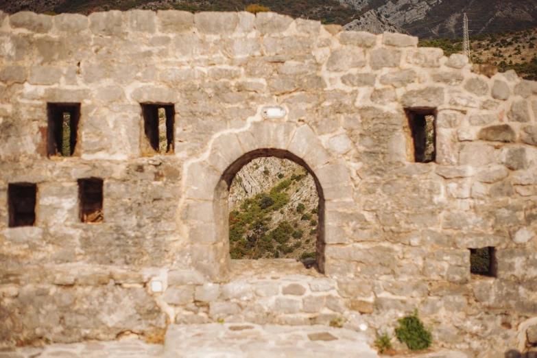 an image of a stone wall that looks like an old building