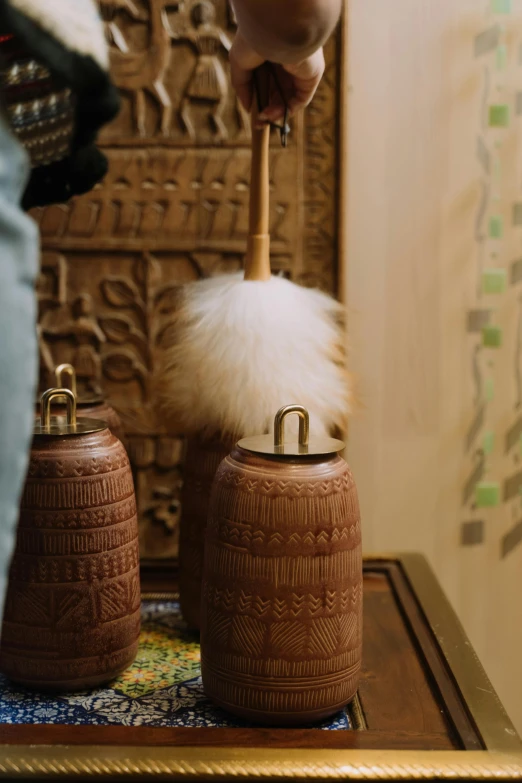 two unique hand carved teapots are on display