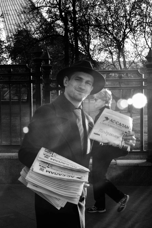 a person that is carrying many books to his head