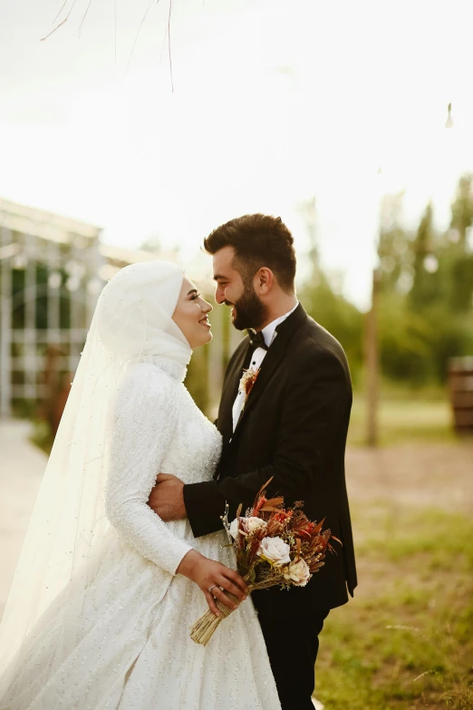 the bride and groom emce while looking at each other