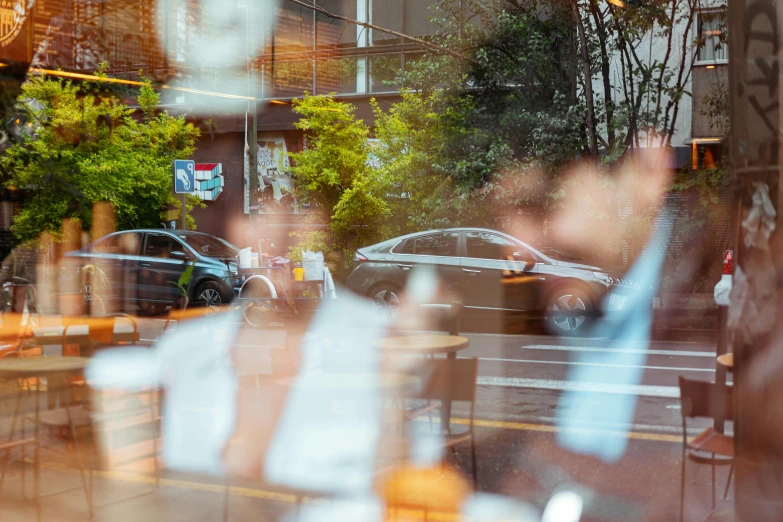 a car is in the distance through a store window