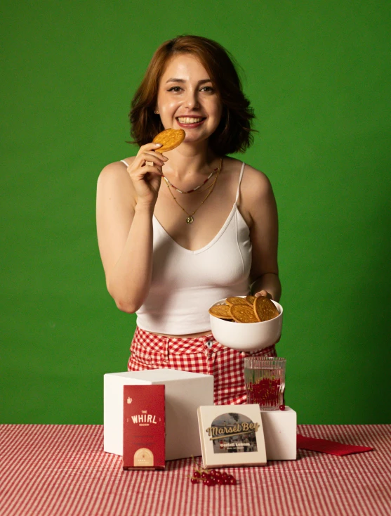 the woman is posing for the camera with her food