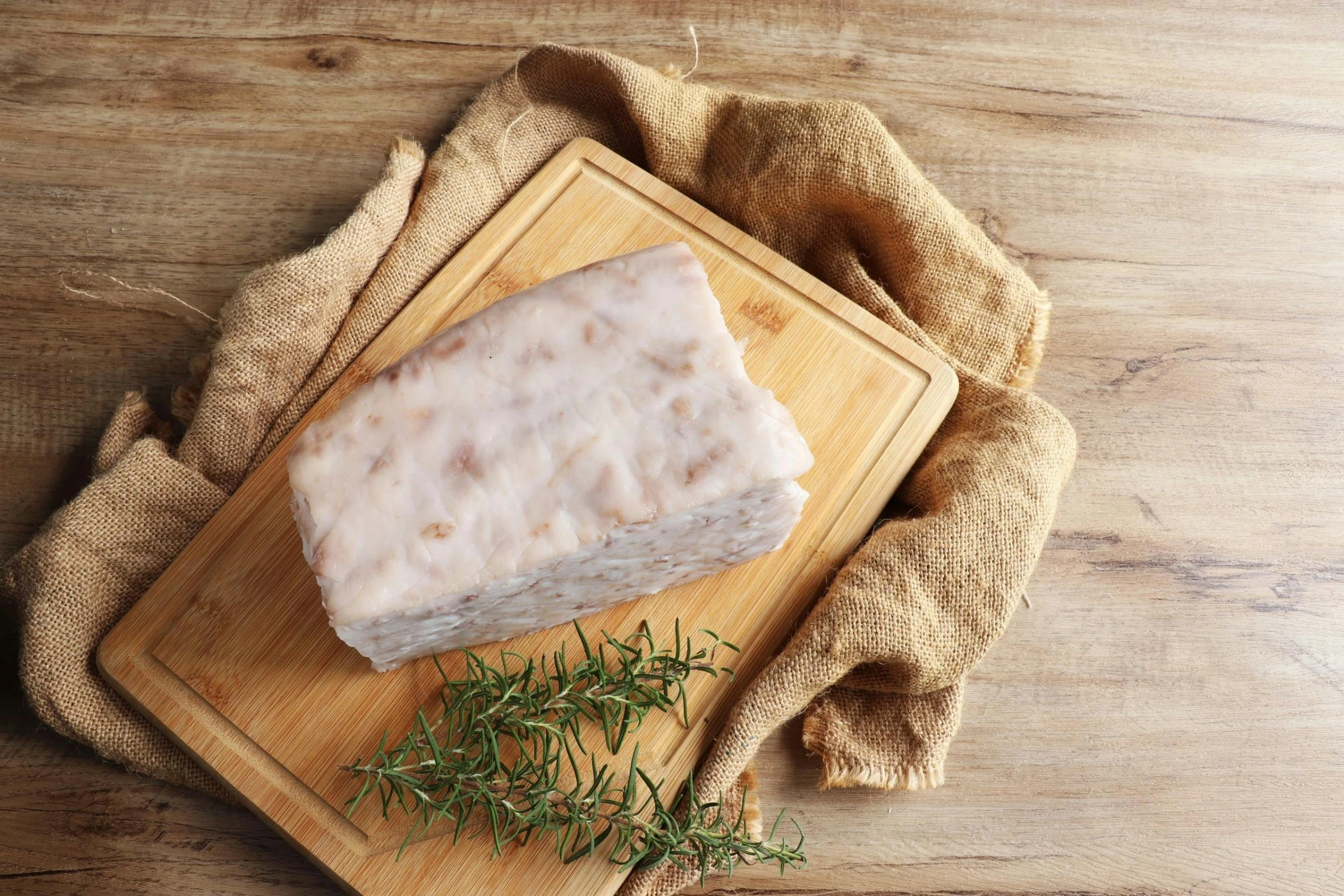 a block of bread on a wooden board