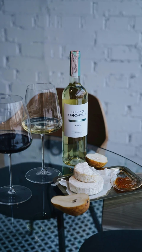 a glass table that has some wine on it