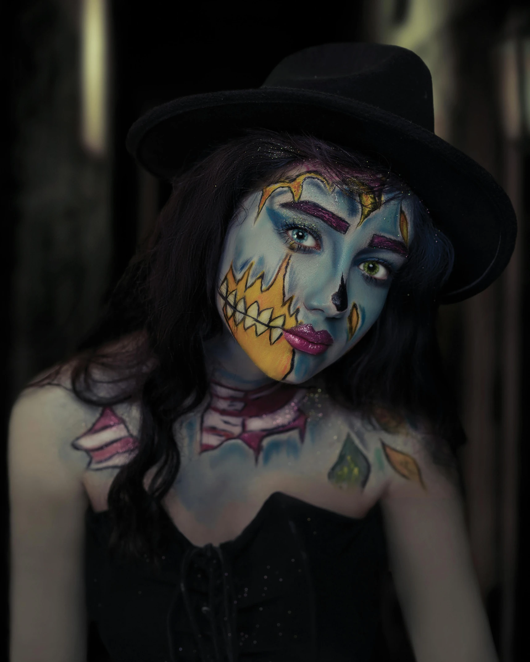 a woman with blue and yellow face paint