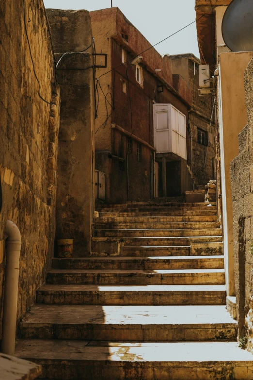 some stairs going up to some buildings near each other