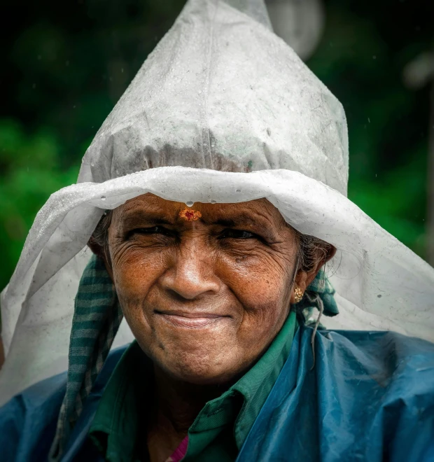 the woman is posing wearing a large hat