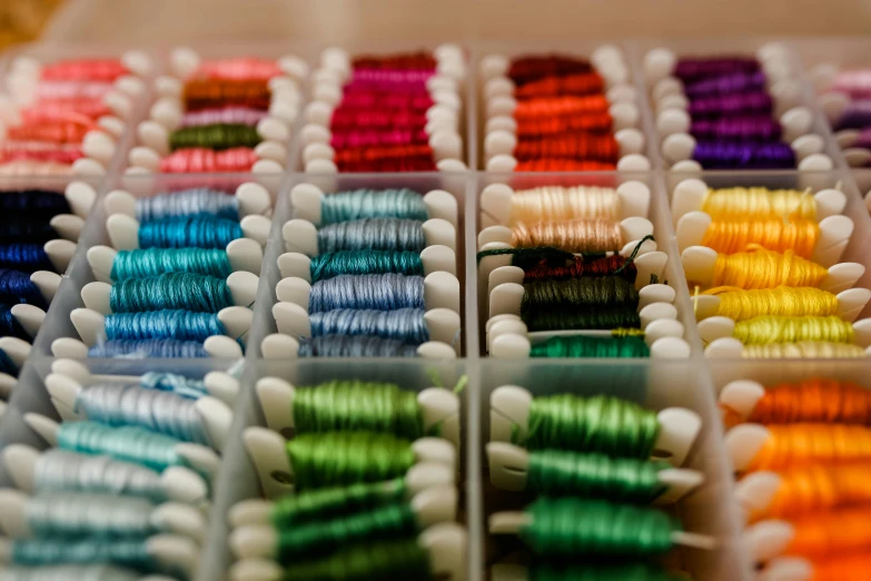 this is a box filled with colored thread