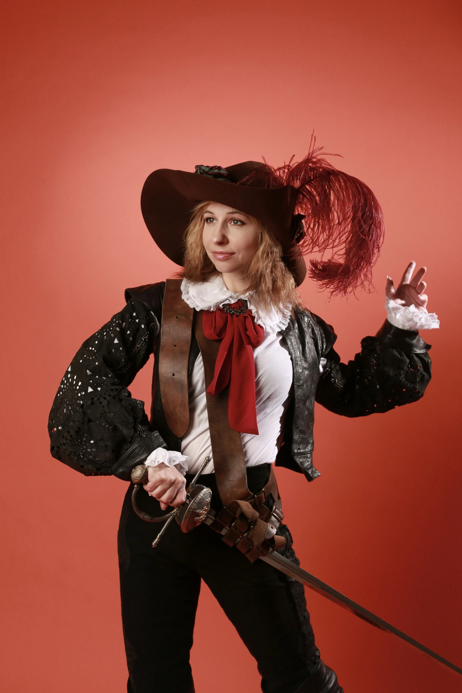 a beautiful woman dressed in an old fashioned outfit holding a whip