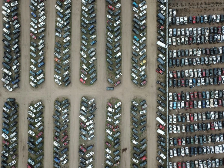 two different pictures of parking spaces one is empty and the other has a bunch of parked cars