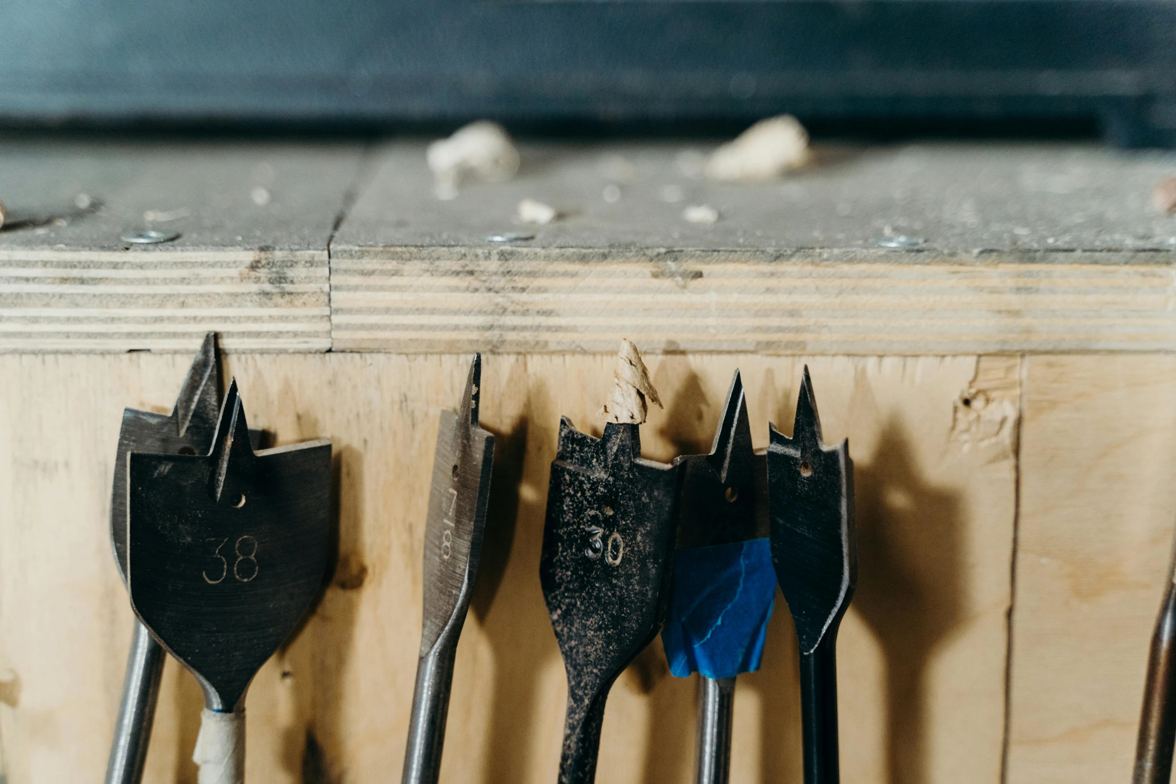 the workbench shows a variety of bits, used for drilling screws