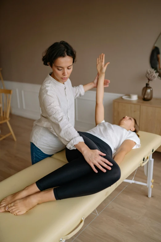 a woman receiving her foot massage by the doctor