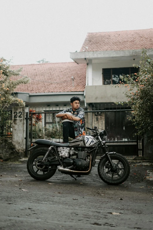 a man that is sitting on a motorcycle