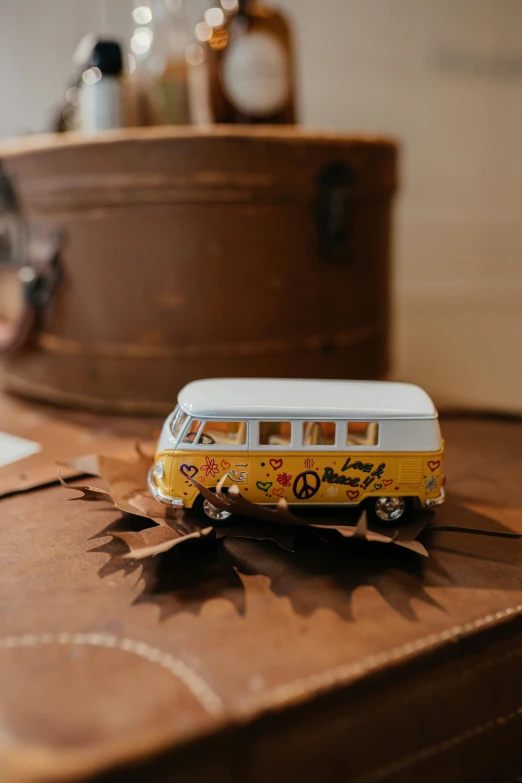 a bus model is placed on the back of a suitcase