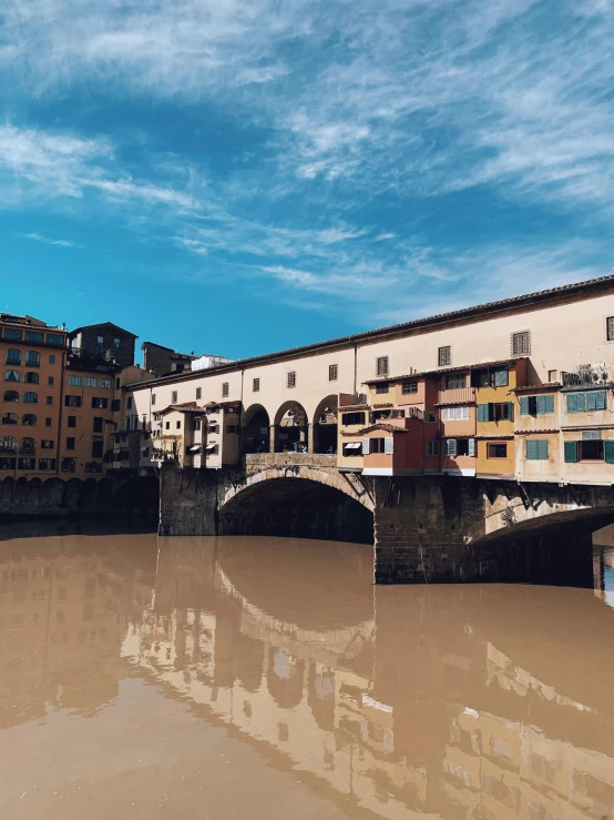 a river running under a city with buildings near by