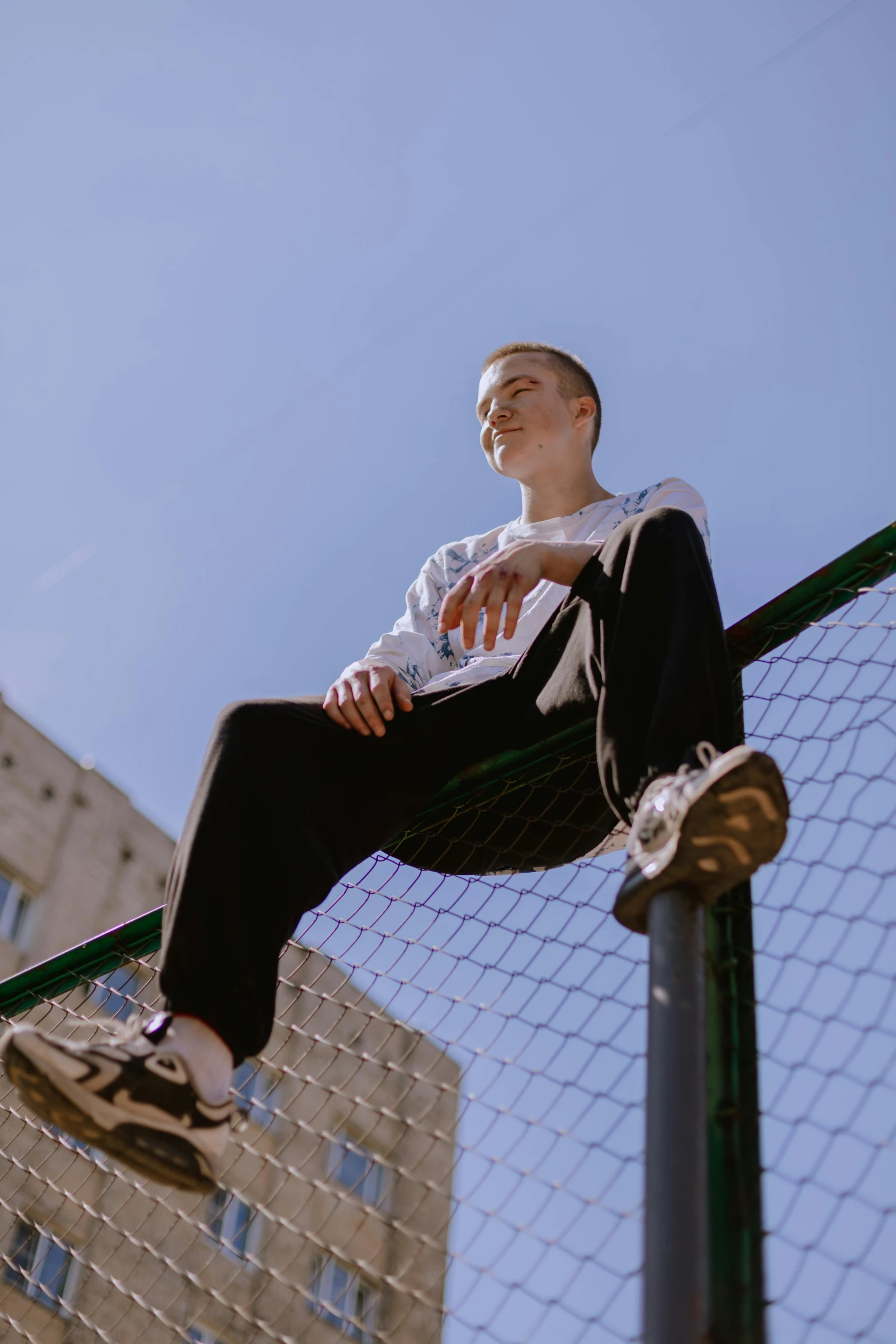 a man is posing with his feet in the air