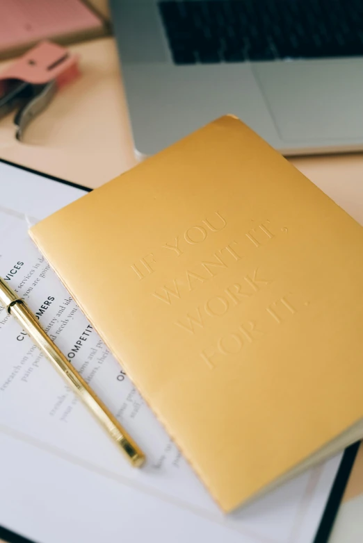 a close up of a writing paper with a pen on it