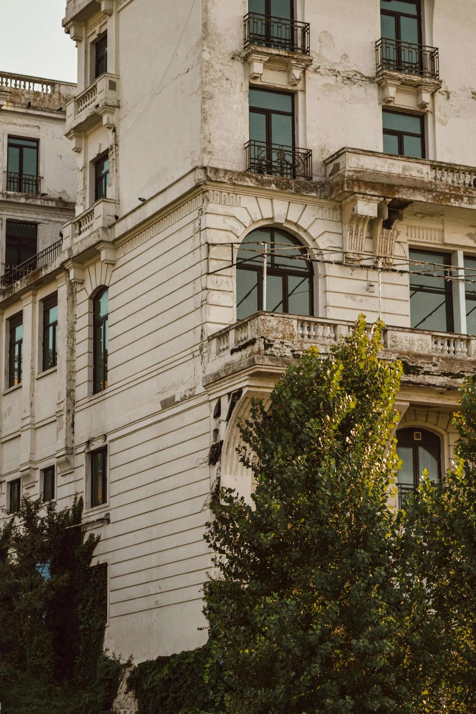 a large white building with balconies and windows