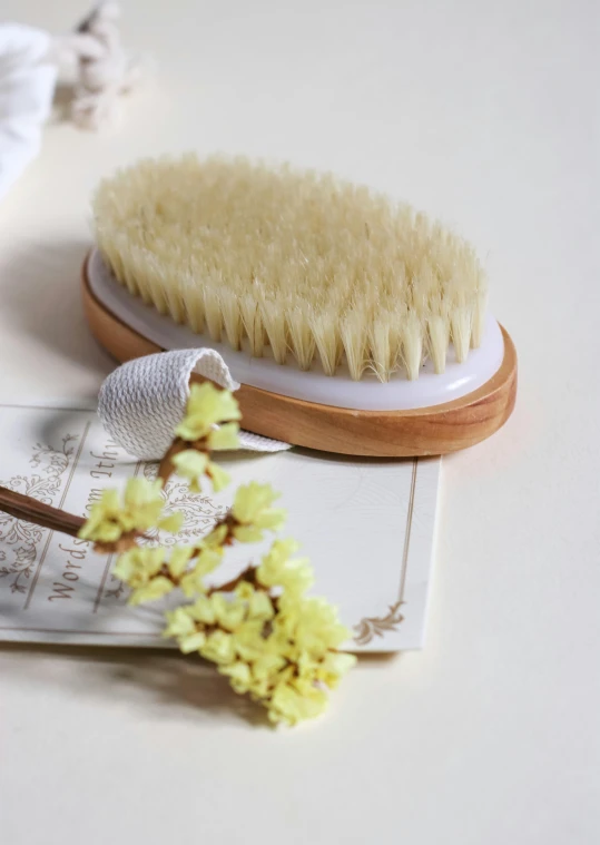 a brush on top of a white sheet