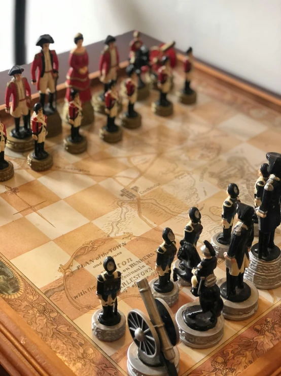 a close up of a chess board with toy soldiers on it
