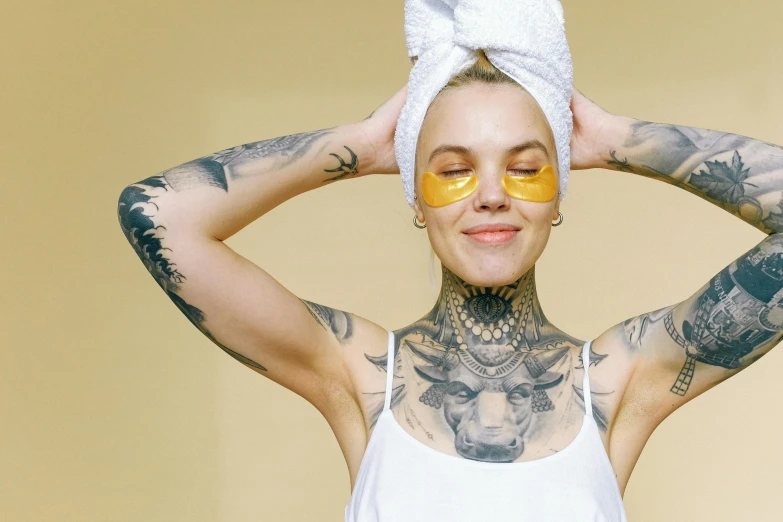 a woman wearing yellow eye masks is posing