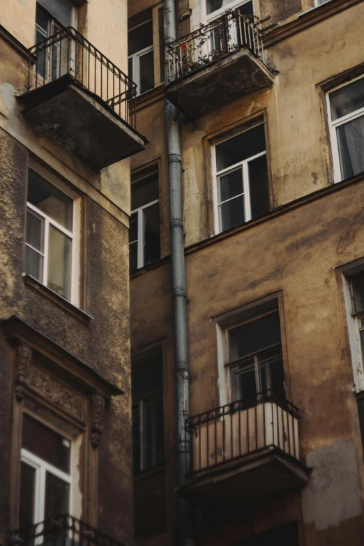 two different balconyed buildings with one balconium in it