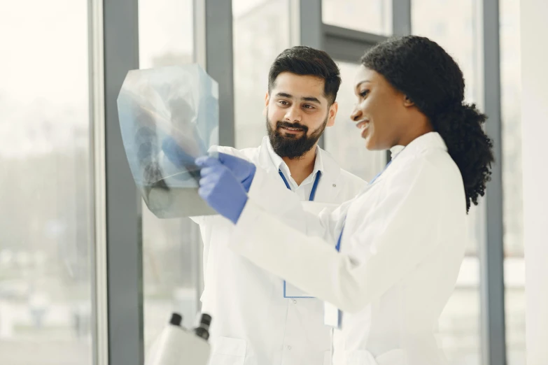 the woman is standing next to the male doctor