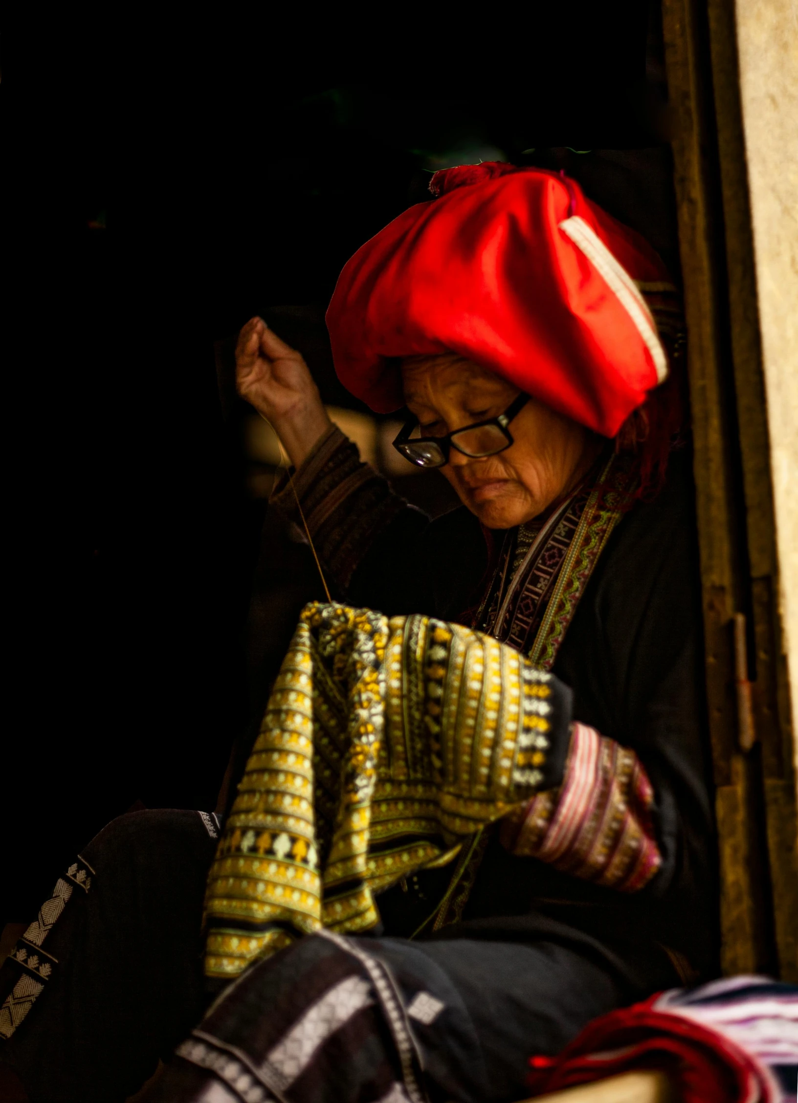 a woman sewing on her hands