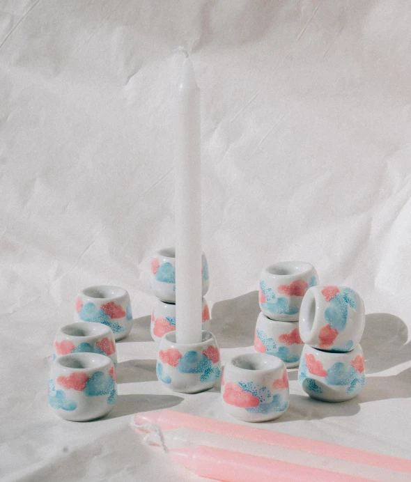 a group of tiny vases on top of a table