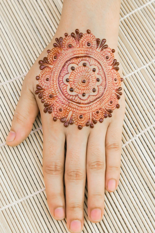 a beautiful decorated hand with dots on it