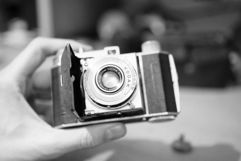 a black and white po of an old camera