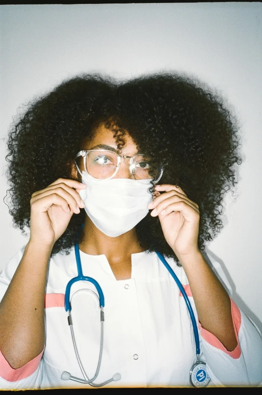 a young woman with a medical mask covering her face