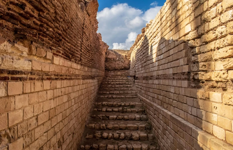 a close up of a stairway that is between two buildings