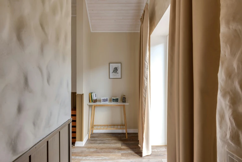 view of an empty hallway with a chair in the background