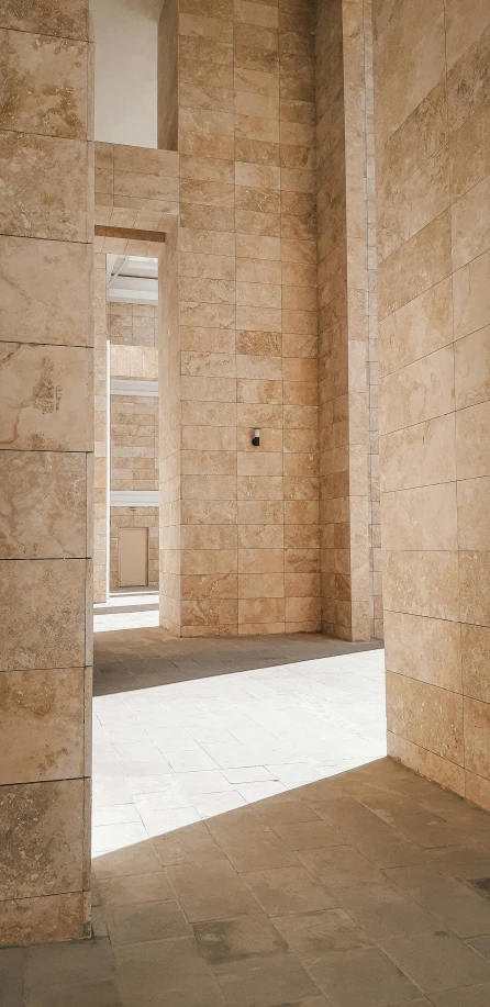 a empty room with white bricks on the walls and a ladder