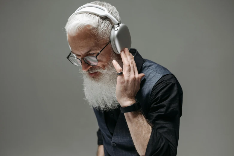 a man is wearing headphones and listening