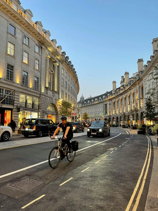 a person is riding their bike down the street