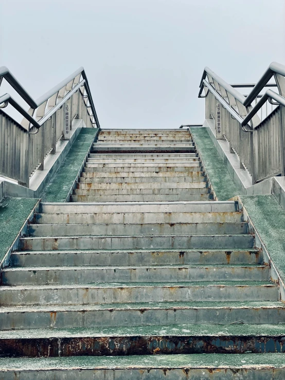 a set of steps leading to some very tall buildings