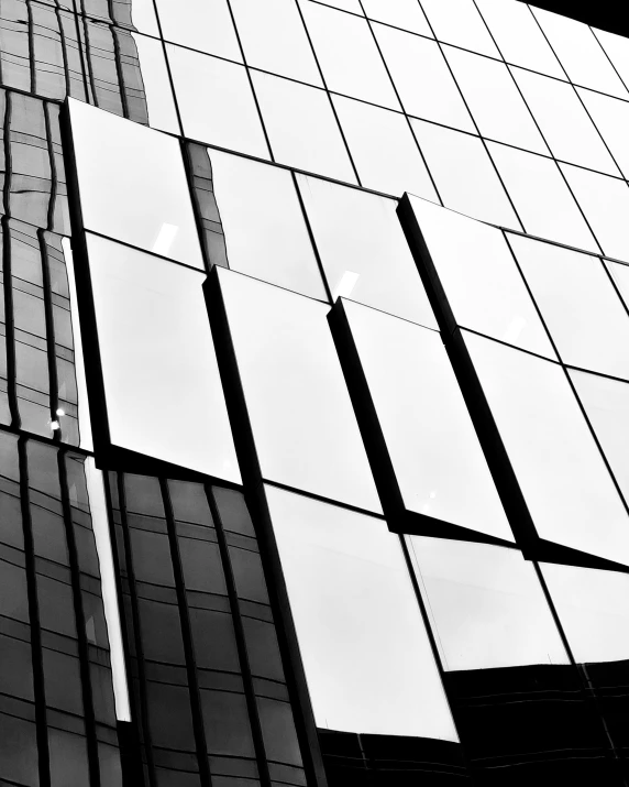 a black and white image of a very tall building