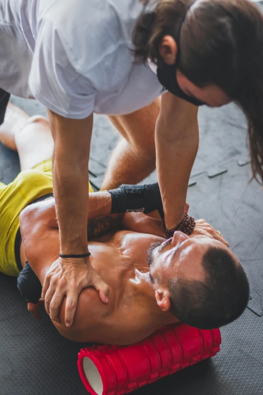 man using a tape to maintain his body from being injured