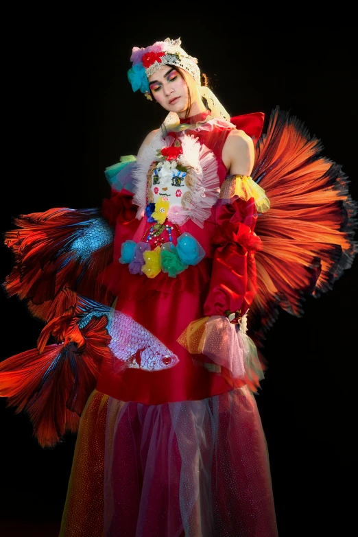 a woman wearing a multi - colored costume and headdress